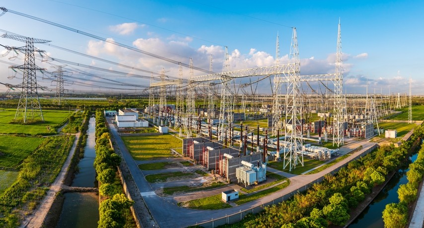 High voltage substation supporting a power grid.